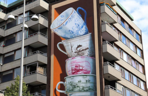 Teacups spill out of a Helsingborg building in Leon Keer’s latest artwork