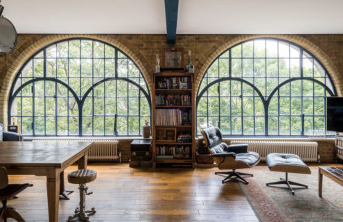 Industrial windows steal the show inside this London loft